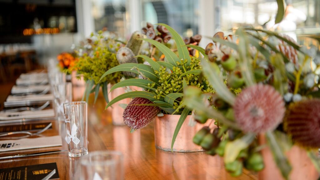 A bouquet of flowers at a nice table setting